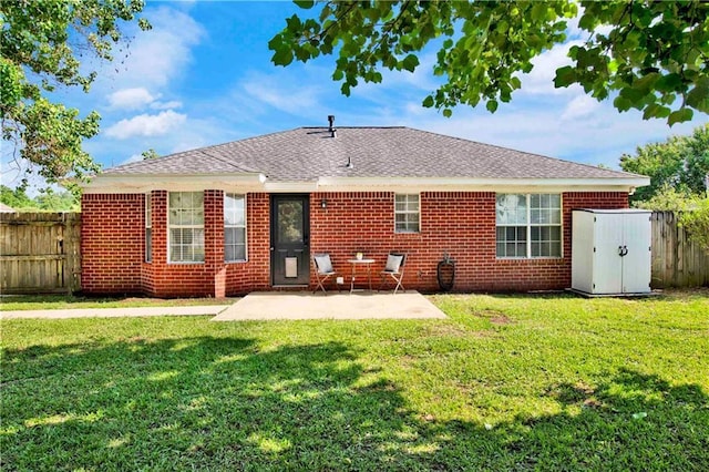 13310 August Dr, Mobile, AL 36695 - rear view of property with a storage unit, a patio, an outdoor structure, and brick siding