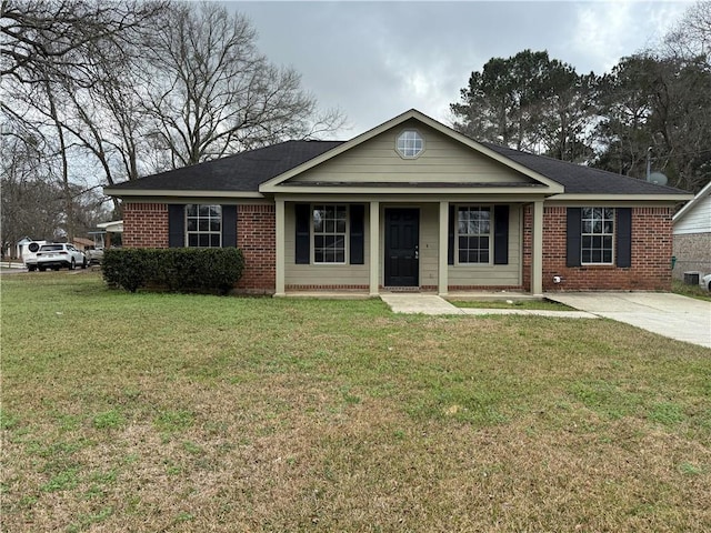 single story home featuring brick siding, a porch, and a front yard