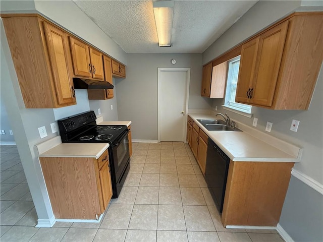 kitchen featuring brown cabinets, black appliances, a sink, under cabinet range hood, and light countertops