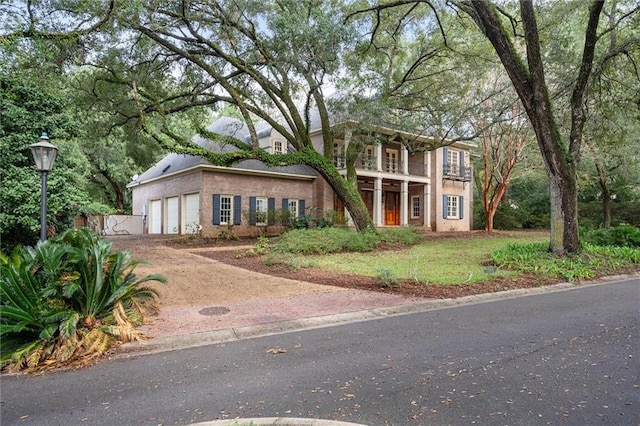 view of front of house with a balcony and a garage