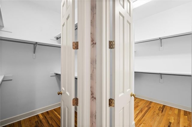 walk in closet featuring hardwood / wood-style flooring