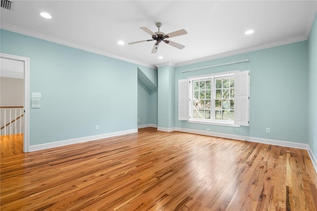 unfurnished room with ceiling fan, light hardwood / wood-style floors, and crown molding