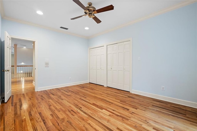 unfurnished bedroom with light hardwood / wood-style flooring, ceiling fan, and crown molding