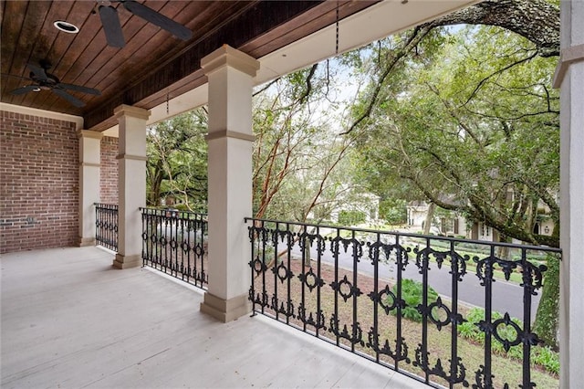 balcony featuring a porch and ceiling fan