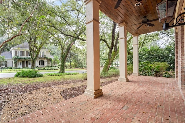 view of patio featuring ceiling fan and a porch