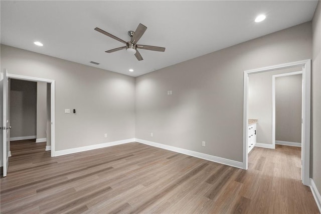 unfurnished bedroom with visible vents, light wood finished floors, baseboards, recessed lighting, and a ceiling fan