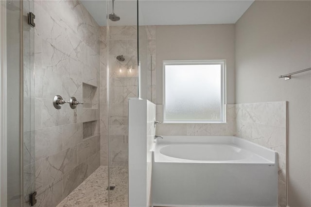 full bath with a shower stall and a bath