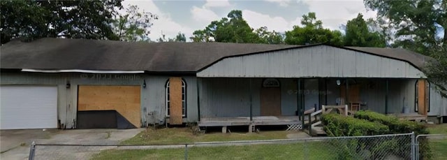 641 Baldwin Dr, Mobile, AL 36610 - view of front facade featuring concrete driveway, covered porch, and a garage