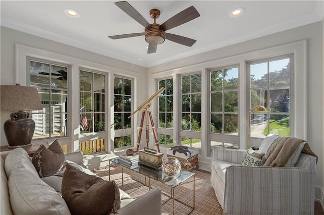 sunroom / solarium with ceiling fan and a wealth of natural light