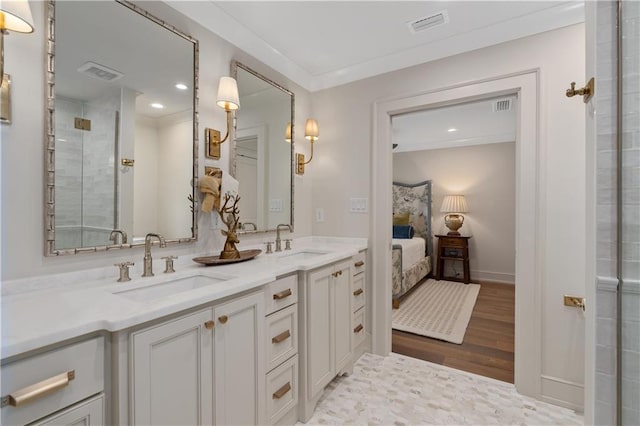 bathroom with vanity, hardwood / wood-style floors, ornamental molding, and walk in shower