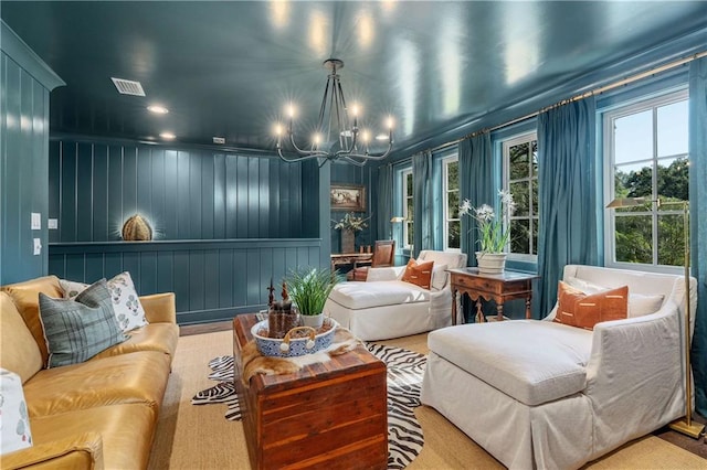 interior space featuring wood walls and a chandelier