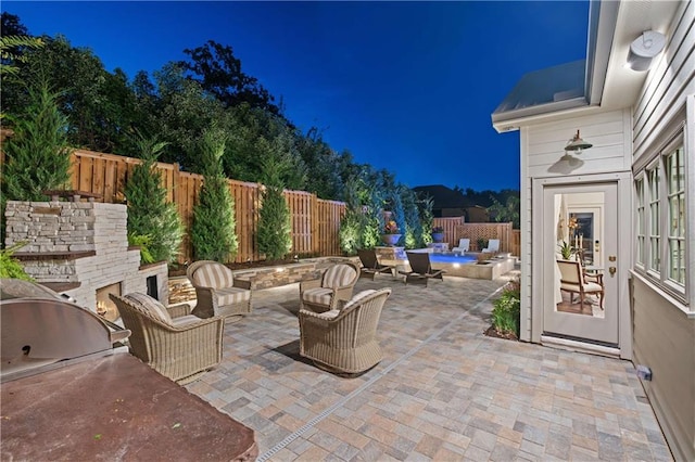 view of patio / terrace with a fire pit