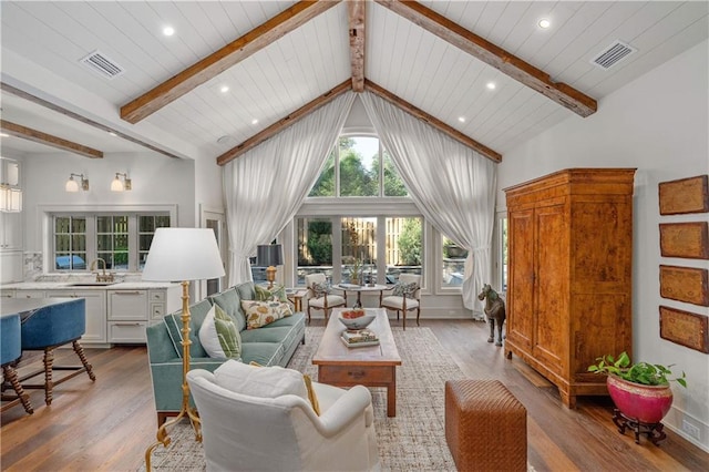 living room with beamed ceiling, wood ceiling, high vaulted ceiling, and light hardwood / wood-style floors