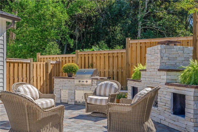 view of patio featuring area for grilling and a grill