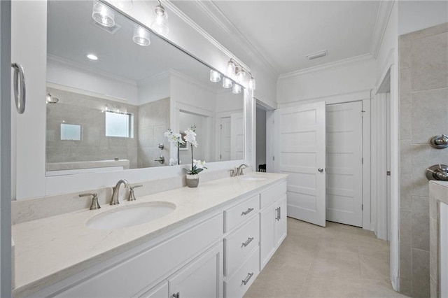 full bathroom with ornamental molding, tile patterned floors, a sink, and double vanity