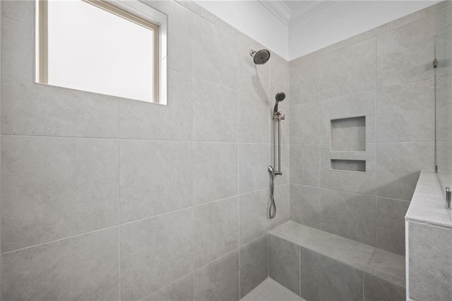 full bath with tiled shower and crown molding