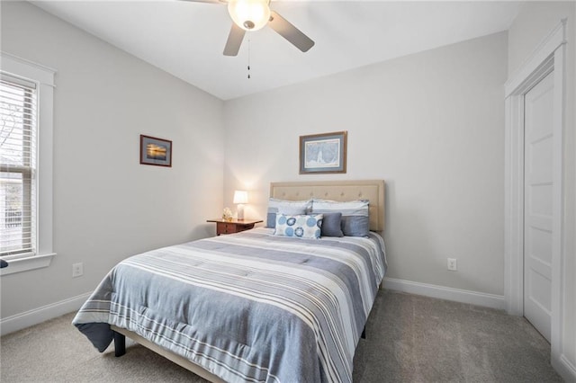 bedroom featuring ceiling fan, carpet flooring, and baseboards