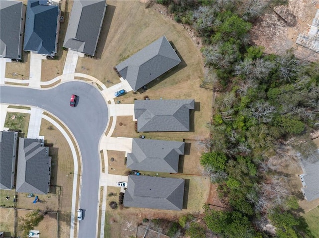 birds eye view of property with a residential view