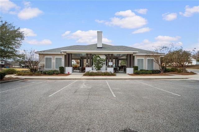 view of property featuring uncovered parking