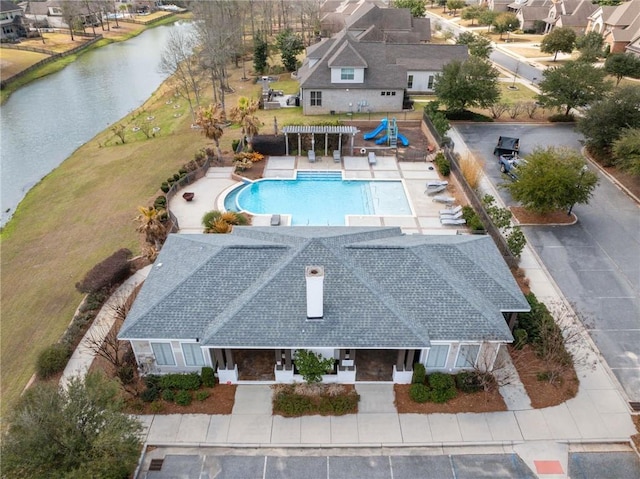 bird's eye view featuring a water view and a residential view