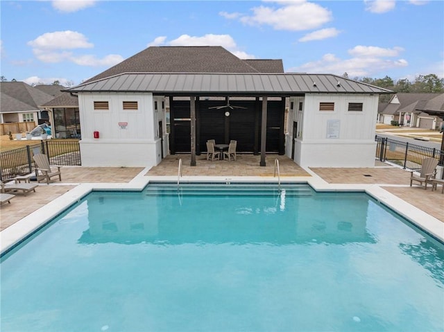 pool featuring a ceiling fan, a patio area, and fence