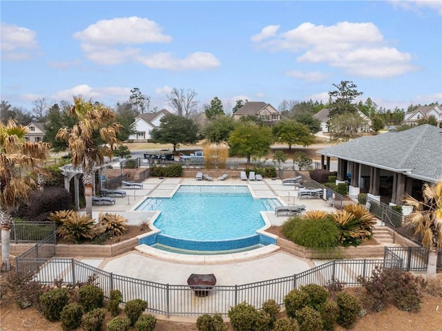 pool featuring a patio and fence