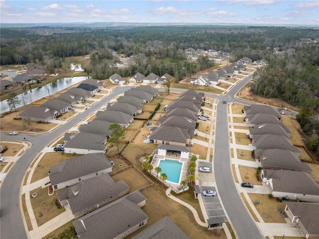 birds eye view of property with a residential view and a water view