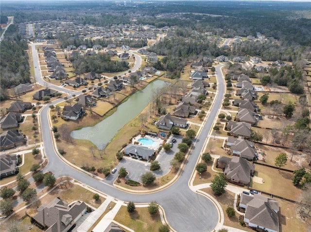 drone / aerial view with a residential view and a water view