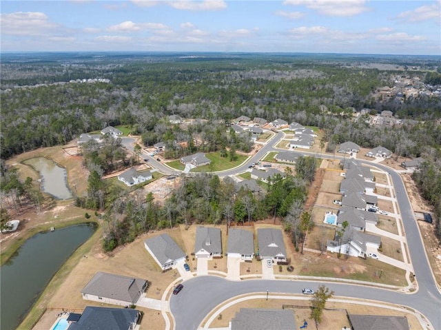 birds eye view of property with a residential view and a water view