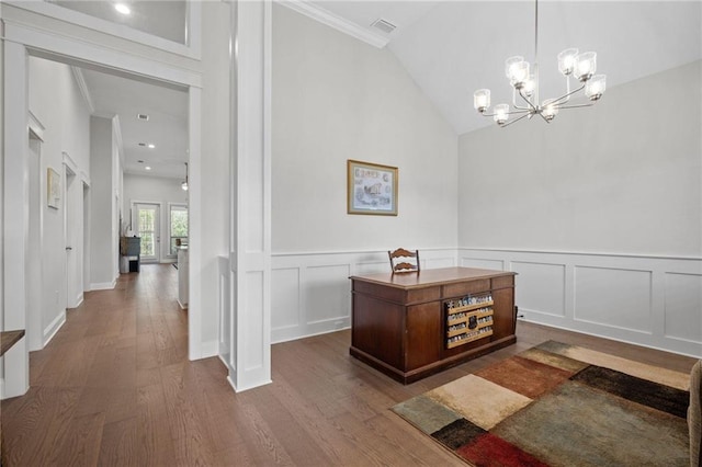 home office featuring lofted ceiling, crown molding, visible vents, and dark wood-type flooring