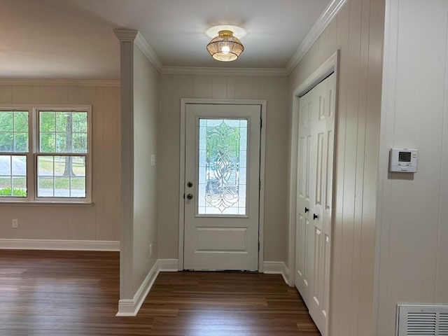 3050 Lacoste Rd, Mobile, AL 36618 - foyer featuring dark wood-style flooring, baseboards, ornamental molding, and a decorative wall
