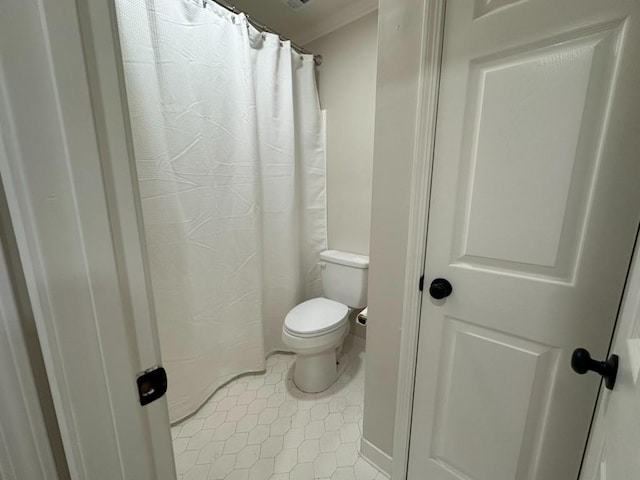 3050 Lacoste Rd, Mobile, AL 36618 - full bathroom with toilet, tile patterned floors, and curtained shower