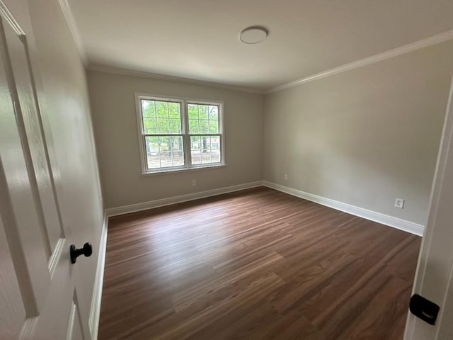 3050 Lacoste Rd, Mobile, AL 36618 - spare room with crown molding, dark wood-style floors, and baseboards