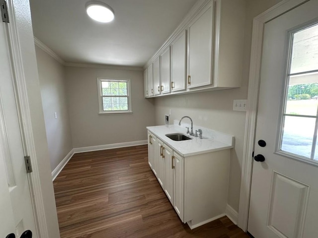 3050 Lacoste Rd, Mobile, AL 36618 - laundry area featuring cabinet space, dark wood-type flooring, baseboards, washer hookup, and ornamental molding
