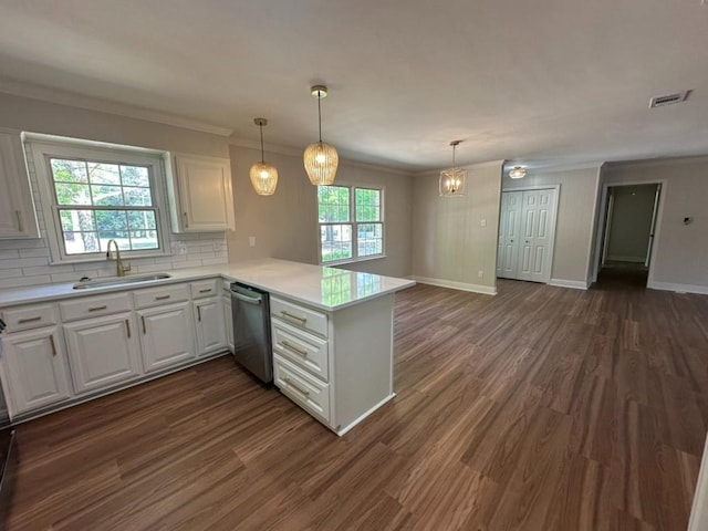 3050 Lacoste Rd, Mobile, AL 36618 - kitchen featuring a sink, dishwasher, a peninsula, white cabinets, and crown molding