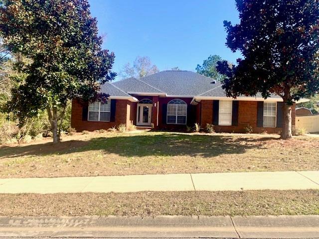 single story home with a front yard