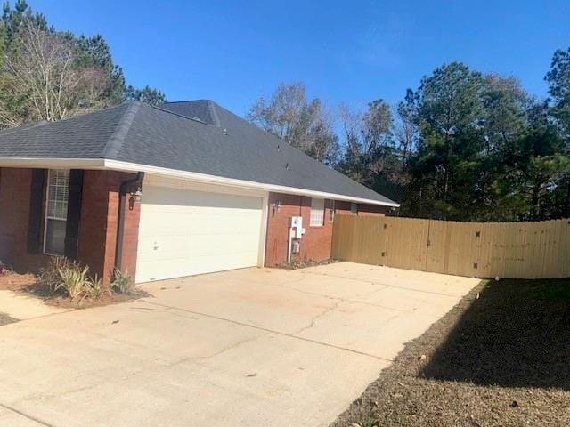 view of side of property featuring a garage