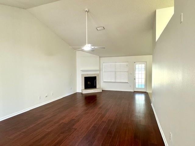 unfurnished living room featuring lofted ceiling, dark hardwood / wood-style floors, and ceiling fan