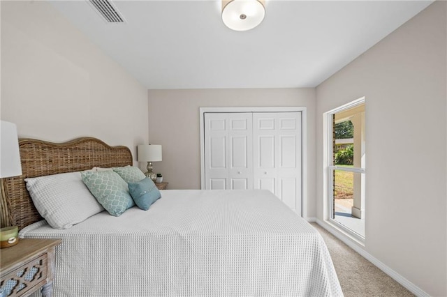 carpeted bedroom with a closet