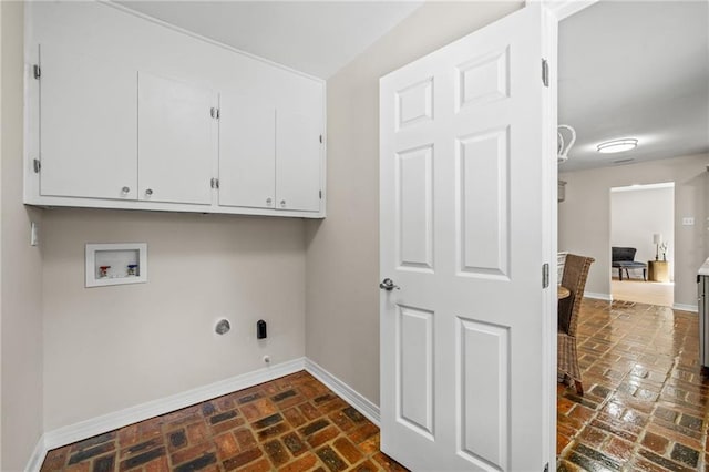 laundry room with hookup for a gas dryer, hookup for a washing machine, and cabinets