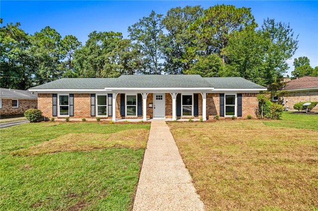 ranch-style house featuring a front lawn