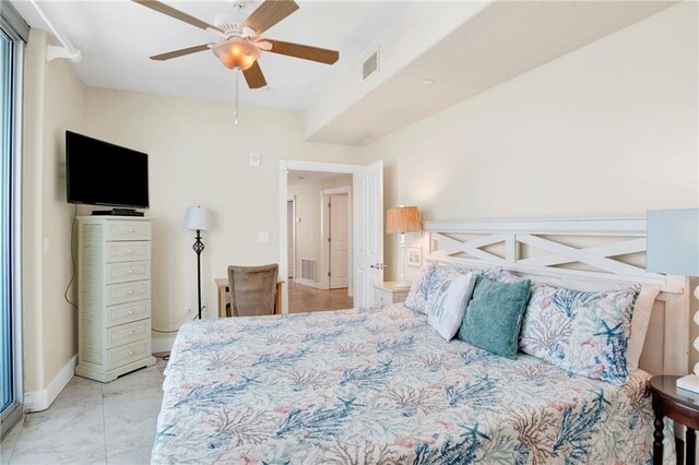 bedroom with baseboards and ceiling fan