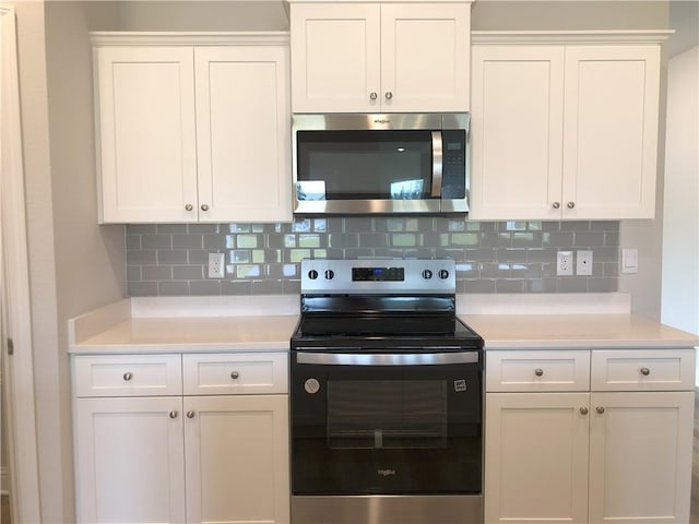 7323 Hawkins Mnr N, Mobile, AL 36695 - kitchen featuring stainless steel appliances, light countertops, and decorative backsplash