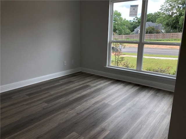 7323 Hawkins Mnr N, Mobile, AL 36695 - spare room with baseboards, plenty of natural light, and dark wood finished floors