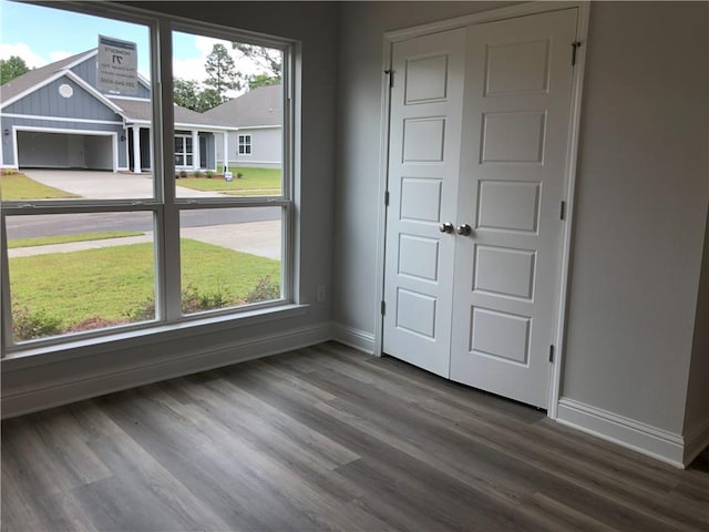 7323 Hawkins Mnr N, Mobile, AL 36695 - unfurnished bedroom with baseboards, wood finished floors, and a closet