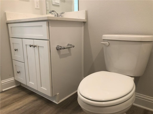 7323 Hawkins Mnr N, Mobile, AL 36695 - half bath featuring wood finished floors, vanity, toilet, and baseboards