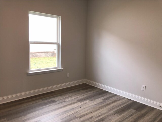 7323 Hawkins Mnr N, Mobile, AL 36695 - unfurnished room featuring dark wood-style floors and baseboards