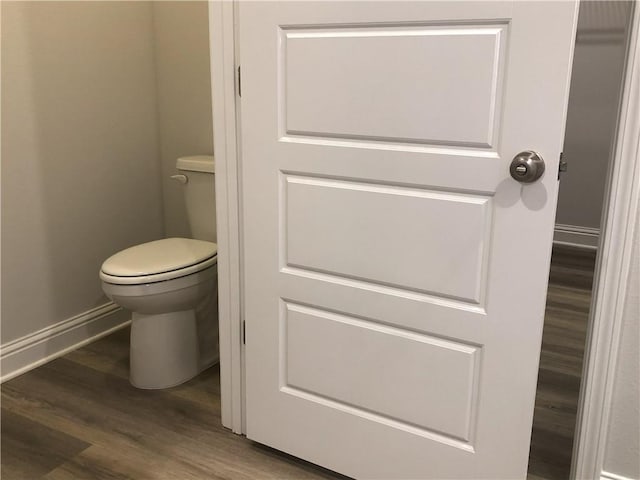 7323 Hawkins Mnr N, Mobile, AL 36695 - bathroom with wood finished floors, toilet, and baseboards