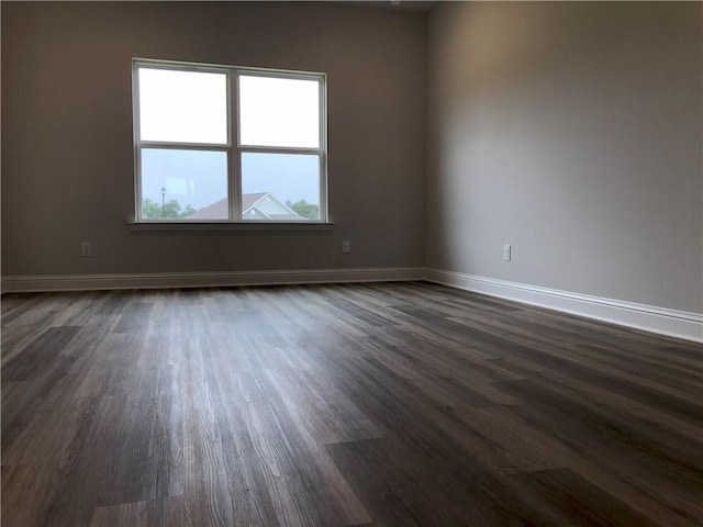 7323 Hawkins Mnr N, Mobile, AL 36695 - unfurnished room featuring dark wood-style flooring and baseboards