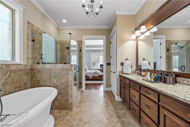 full bathroom featuring a shower stall, a freestanding bath, crown molding, and vanity